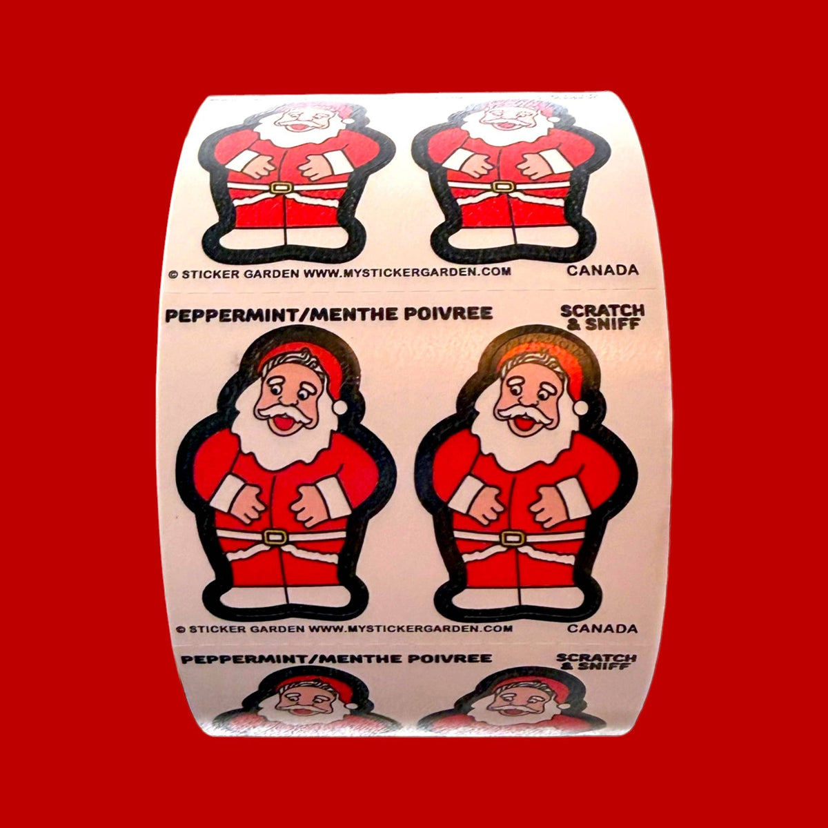 Scratch-and-sniff Santa peppermint sticker roll section with four Santa designs