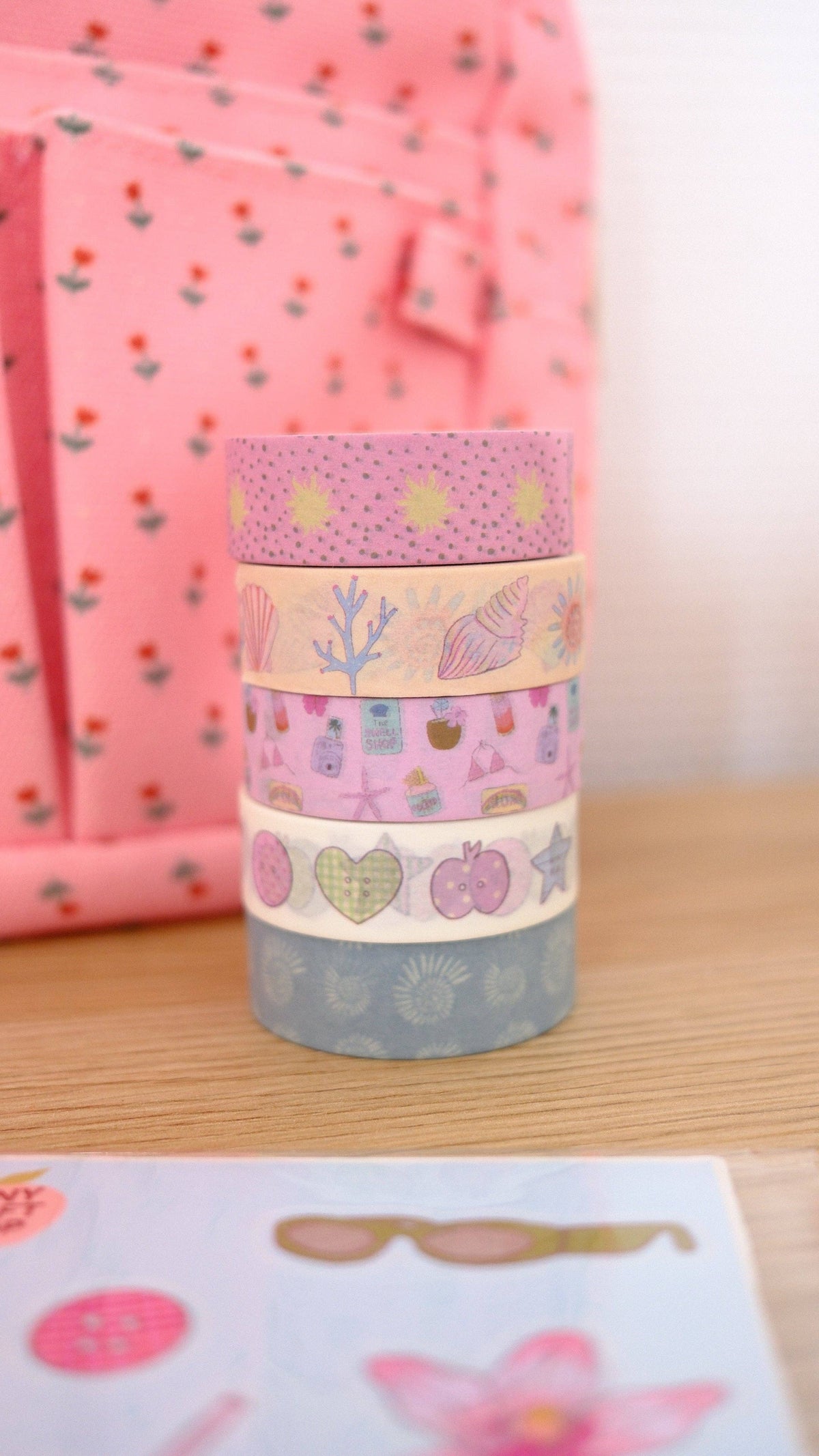 Set of pastel washi tape rolls with seashells, corals, and small ocean icons