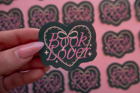 Book Lover heart sticker: dark heart with pink “Book Lover” script