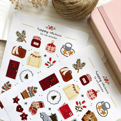 Winter sticker sheet with sweater, mug, holly sprig, gift icons, and a festive sign.
