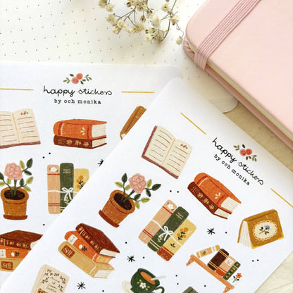 Bookish sticker sheet close-up with books, teapot, and stacked volumes