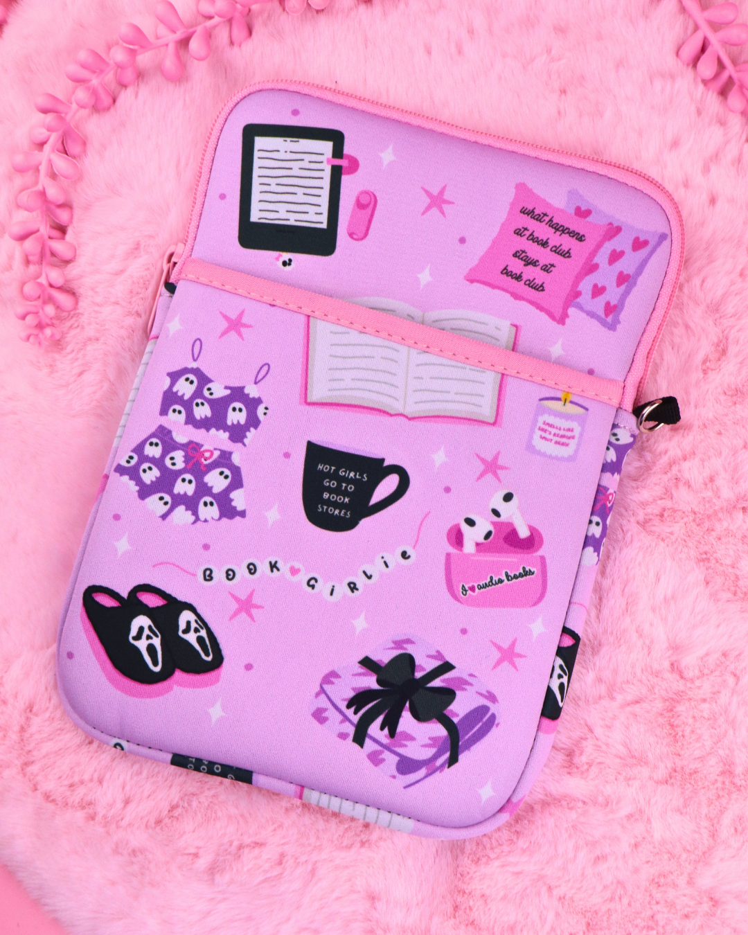 Lavender zipper book sleeve with purple character graphics and inner pockets