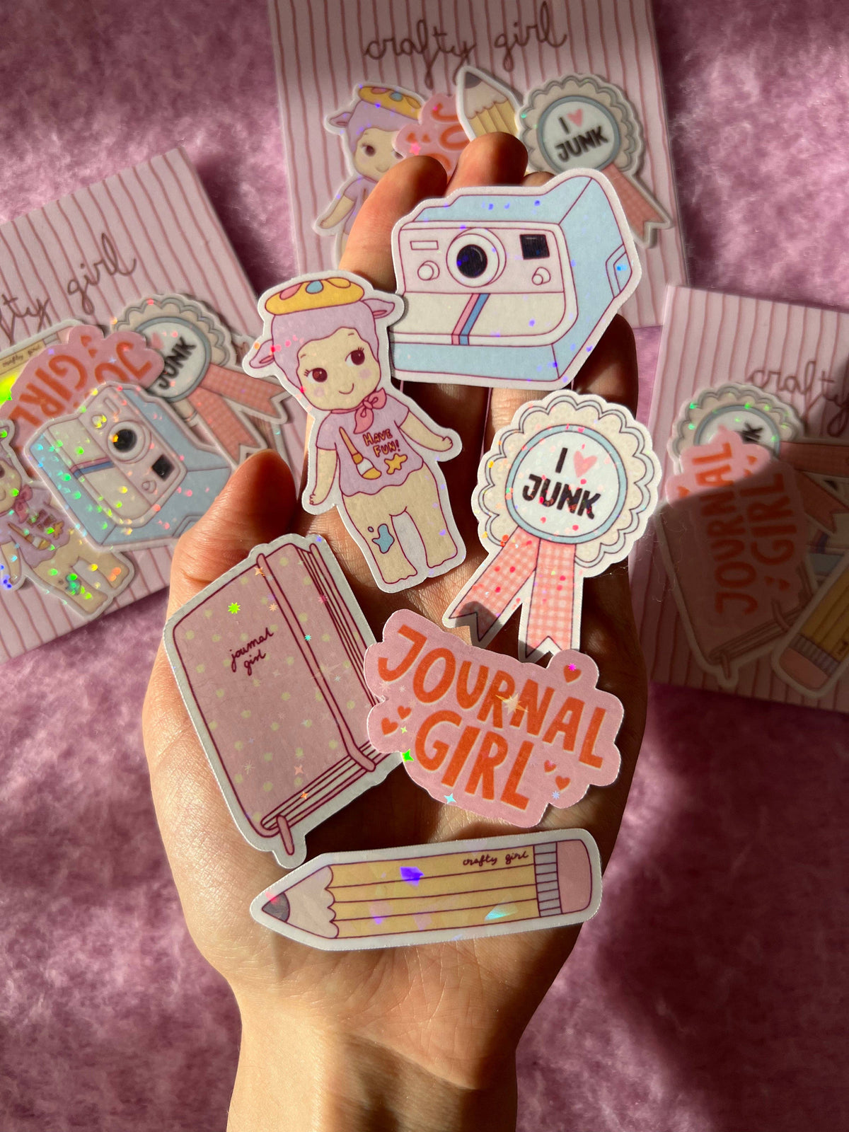 Crafty girl sticker pack with camera and girl stickers plus round 'JUNK' badges, scattered