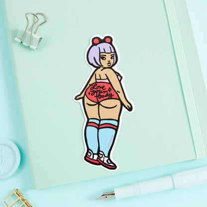 Cartoon vinyl sticker of a stylized woman in a red top and blue striped shorts