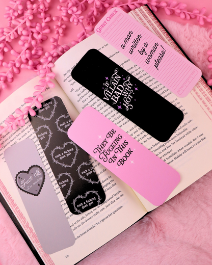 Set of three bookmarks: black, dark gray, and pink with printed lettering