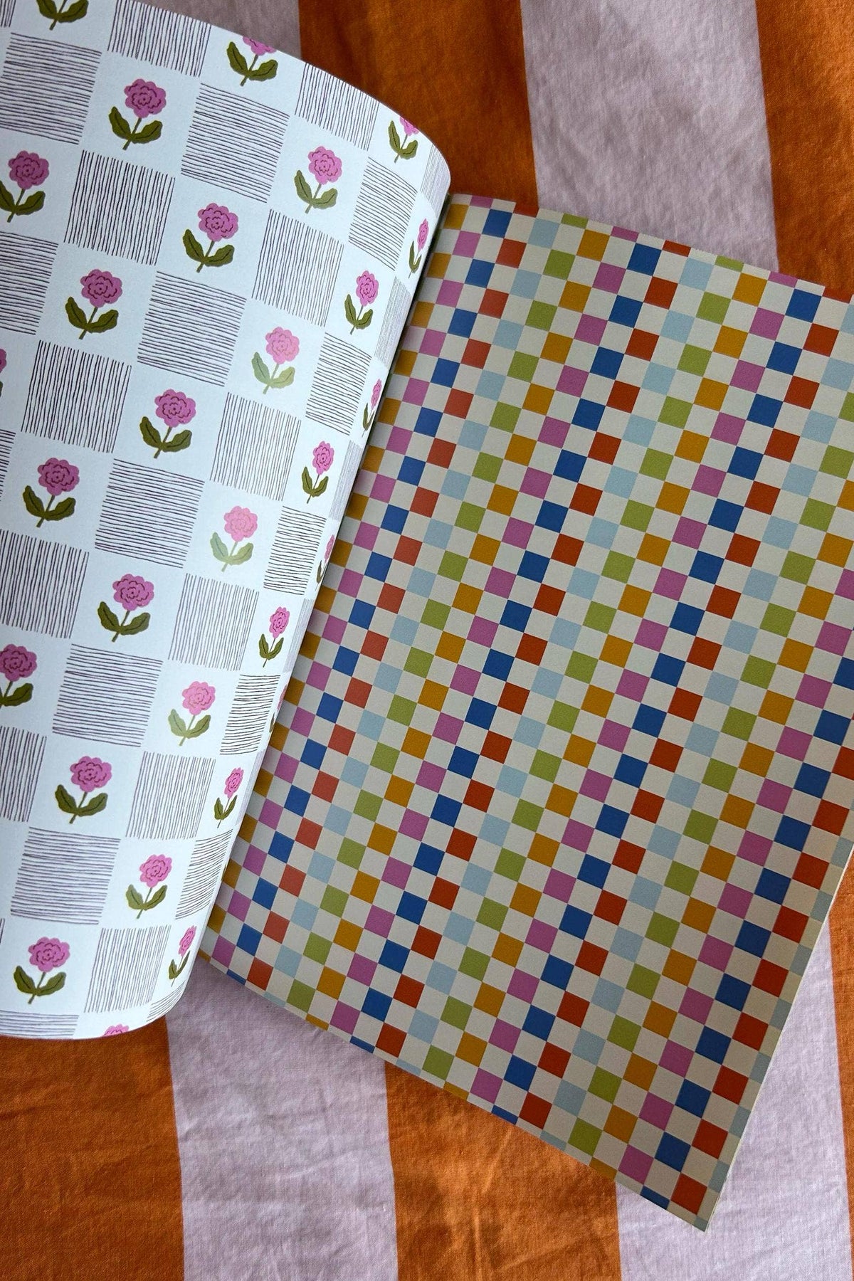 A5 scrapbook paper sheet with multicolor checker pattern and pink rose motifs