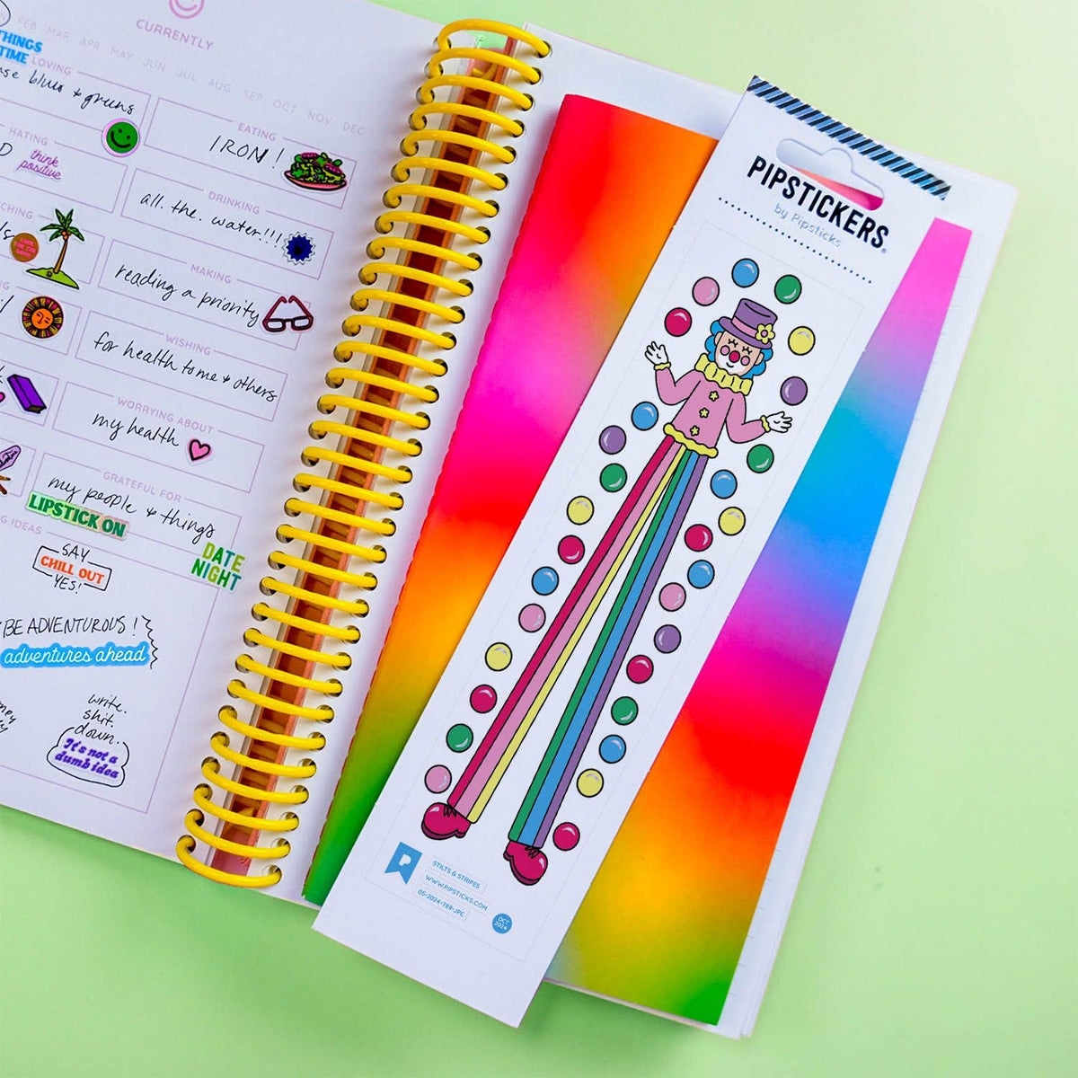 Sticker sheet with cartoon striped character and multicolor dots, gradient rainbow backing