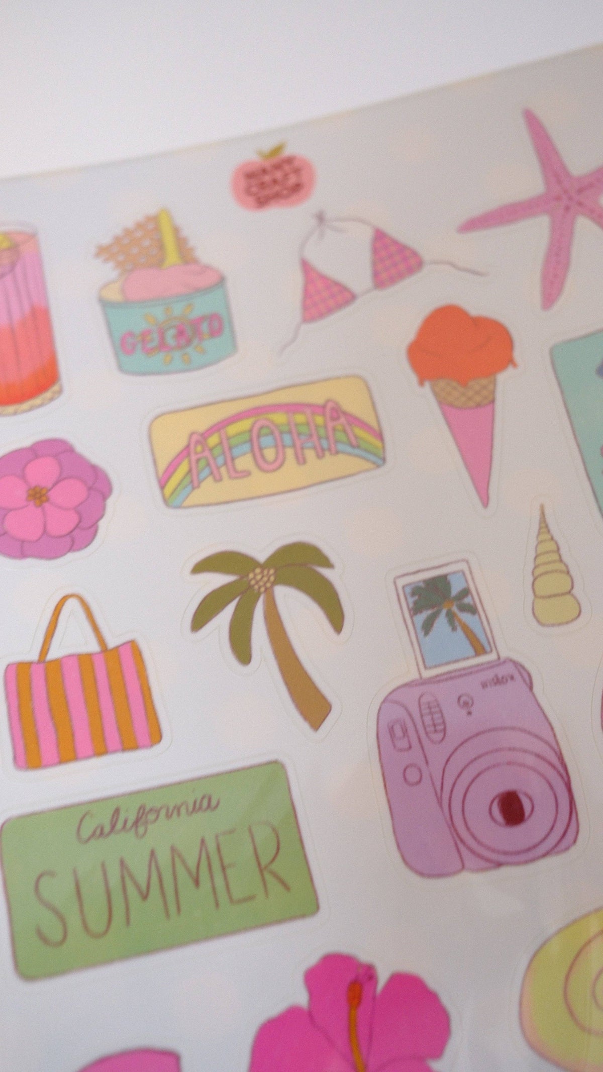 Close-up of an A5 summer sticker sheet with ice cream, camera, palm tree, and text