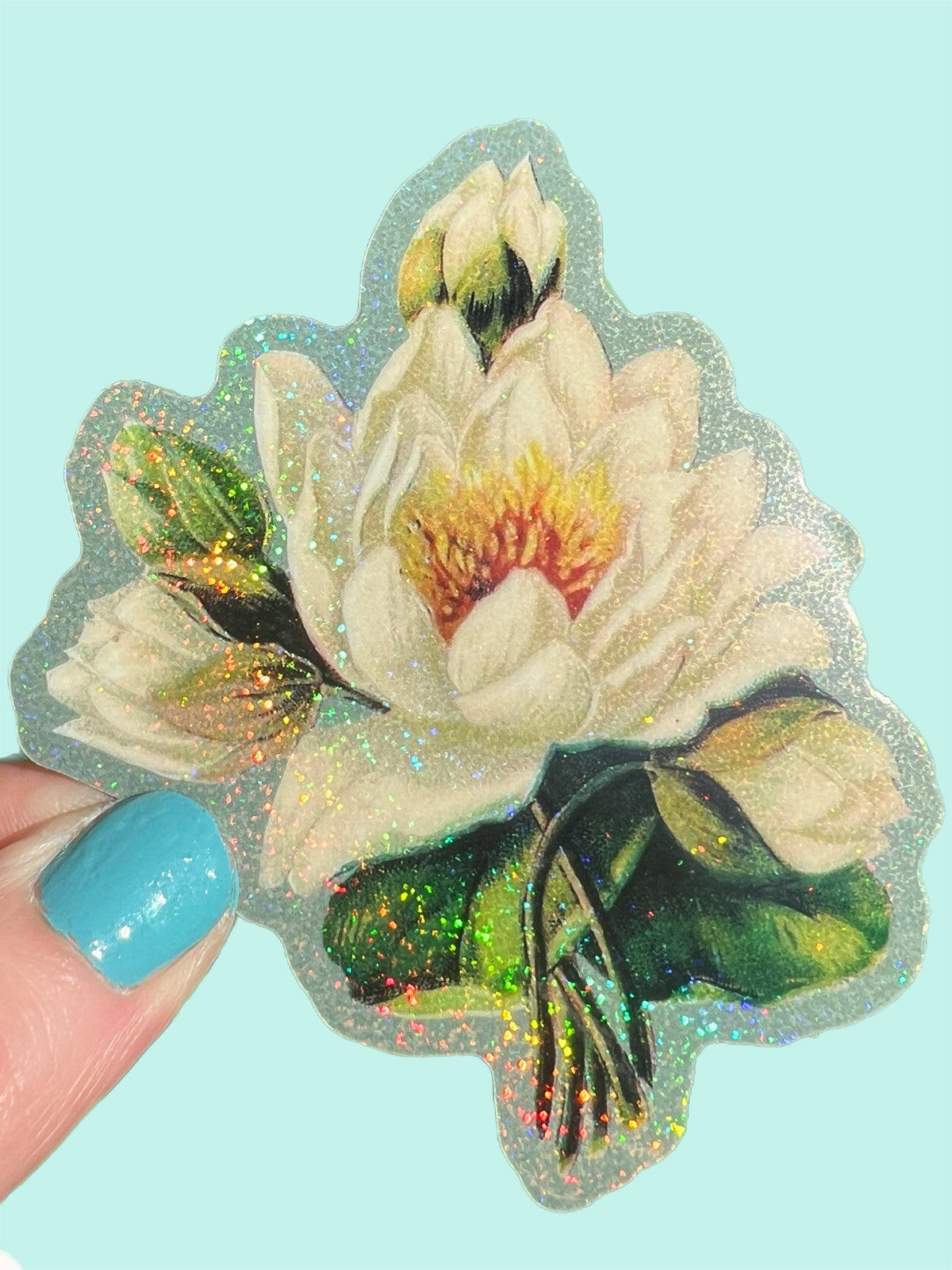 White lotus flower sticker with holographic sparkle, white petals and green leaves, held
