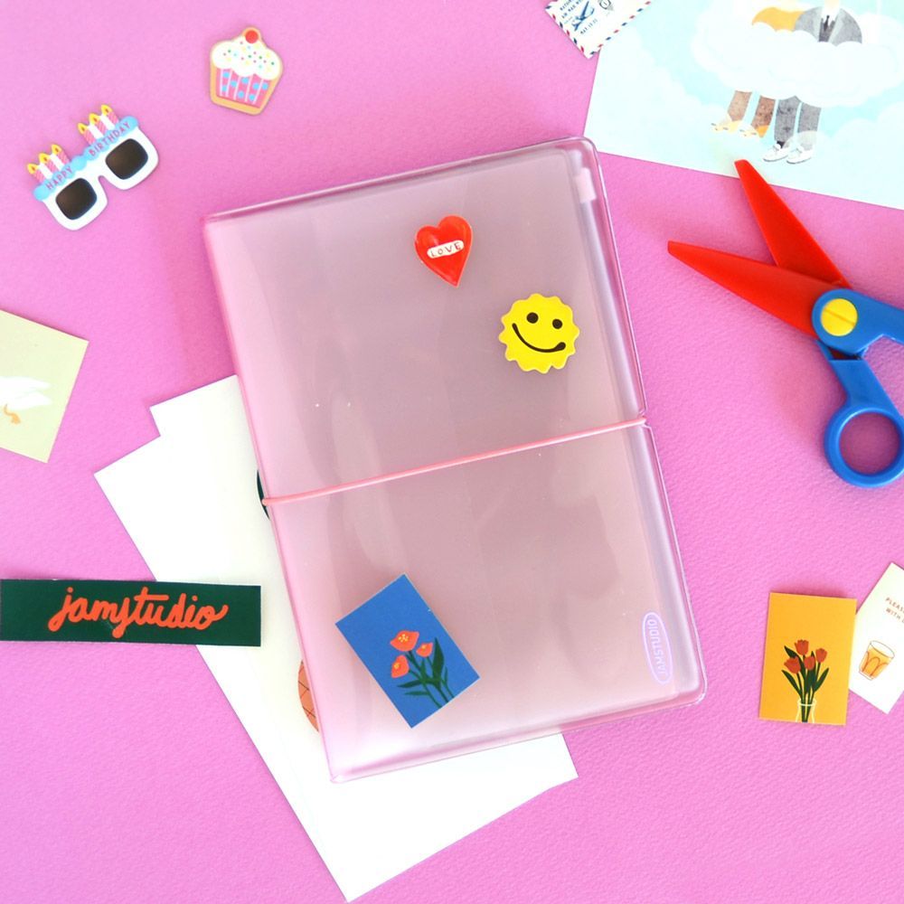 Pink glitter sticker album with sleeves, open, with heart and smiley stickers