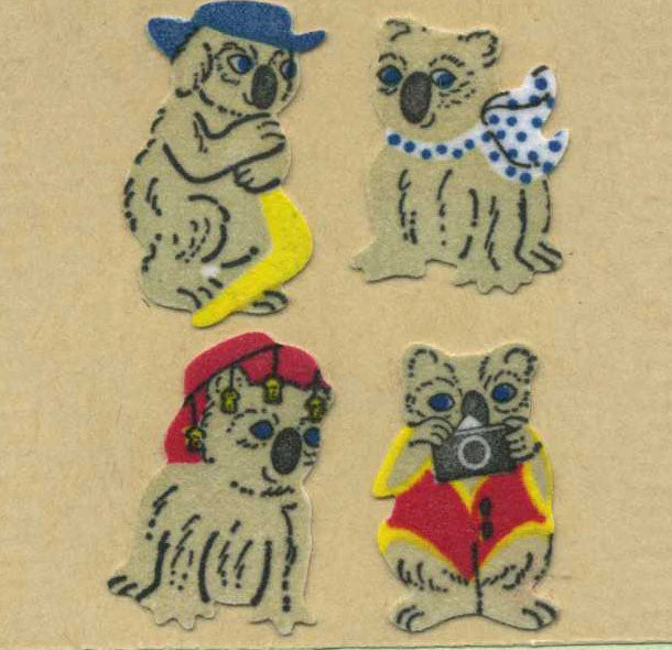 Sticker roll of fuzzy koala stickers, four cartoon koalas in hats and scarves