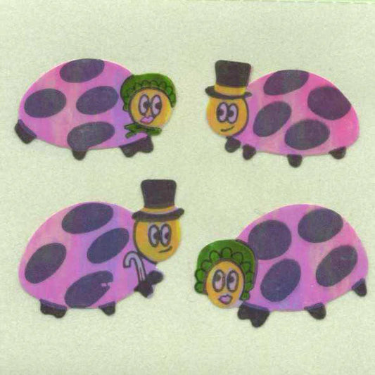 Cartoon ladybird stickers, pink with dark purple spots and green faces, set of four