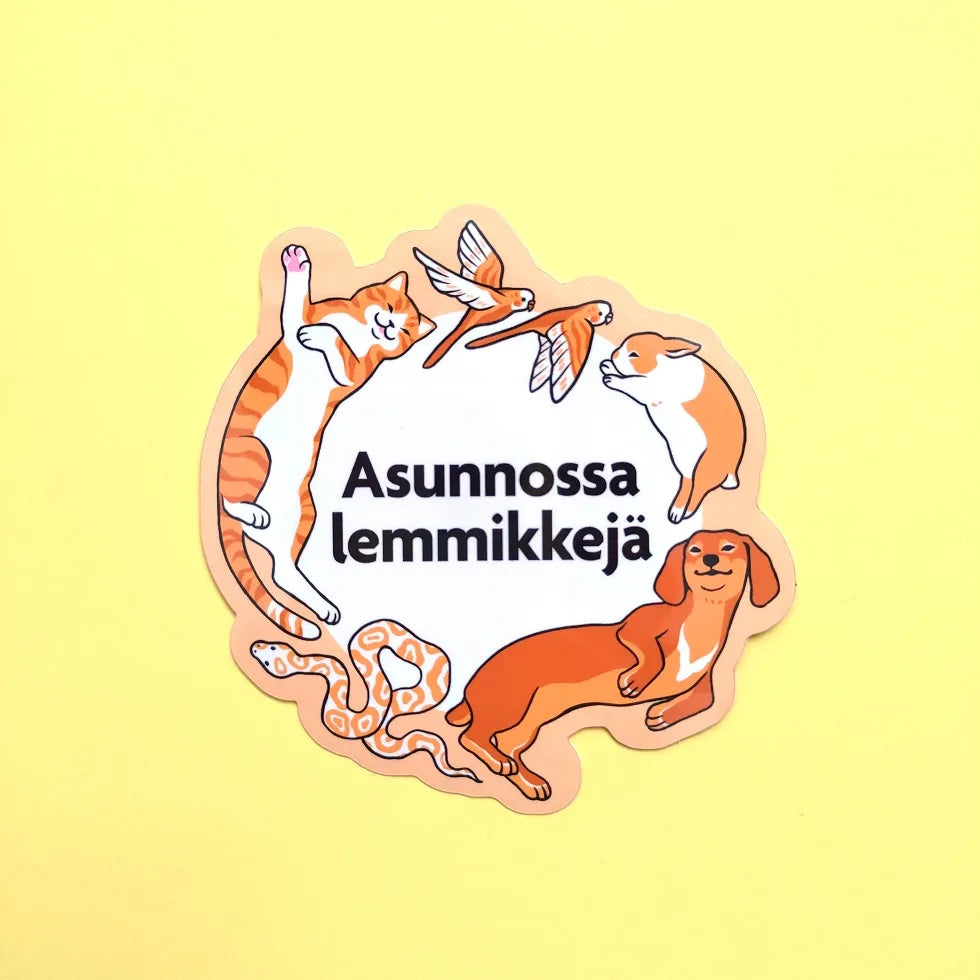 Large vinyl sticker with cats, dog, birds and snake around Finnish text