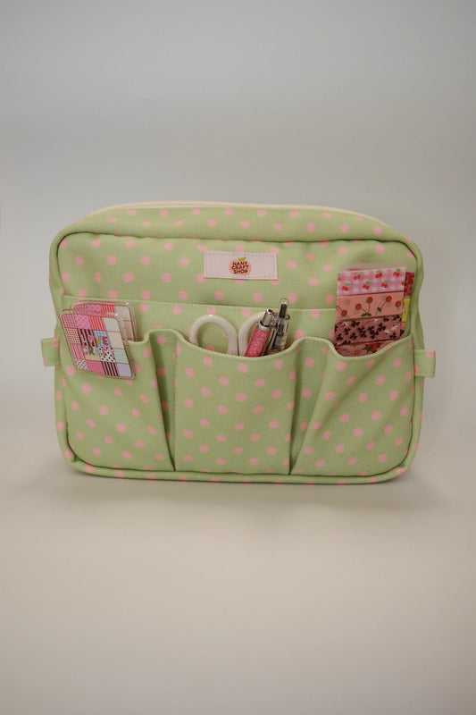 Green polka dot crafting pouch with zipper top and three front pockets