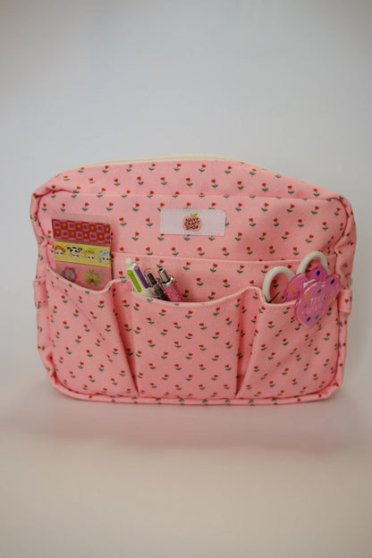Pink floral crafting pouch with front pockets and zip pull, keyring charm