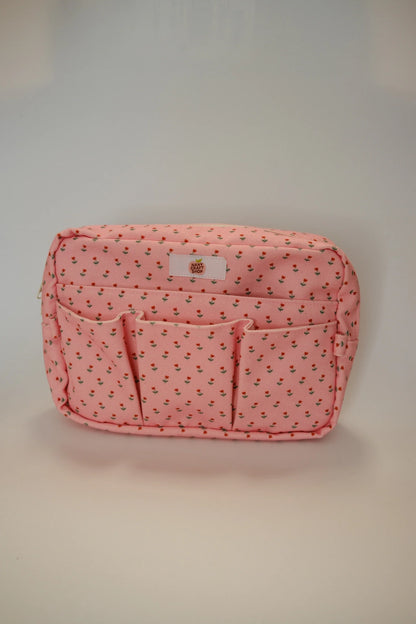 Pink floral crafting pouch with top label patch and front zip sections