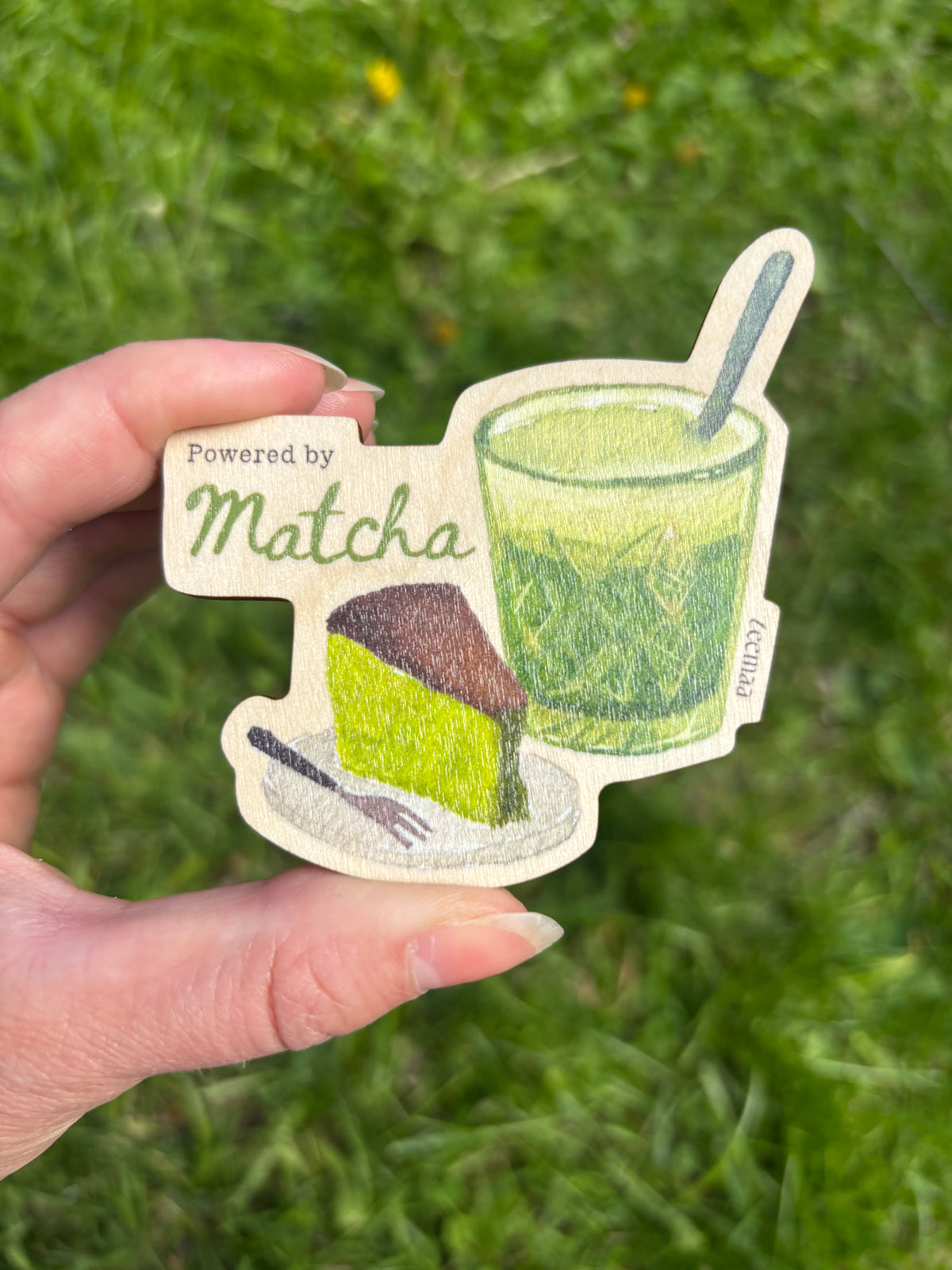 Wooden magnet with matcha cup and wedge graphic, Powered by Matcha text