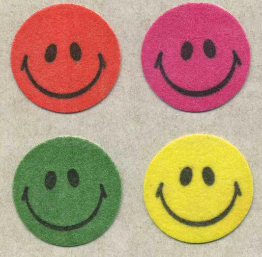 Fuzzy smiley face stickers, four circular colors: red, purple, green, yellow
