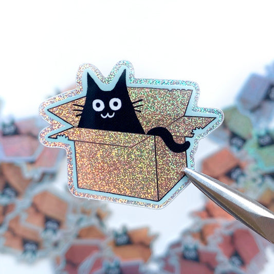 Glitter cat sticker in a box, black cat face with whiskers and open box
